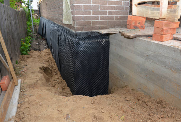 Happy homeowners after waterproofing job in Orient